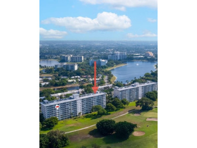 Step into this lower penthouse condo where vintage charm meets on Palm-Aire Country Club and Resort - Palms in Florida - for sale on GolfHomes.com, golf home, golf lot
