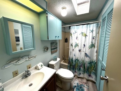This delightful 2-bedroom, 2-bathroom retreat boasts a generous on Lake Henry Golf Club in Florida - for sale on GolfHomes.com, golf home, golf lot