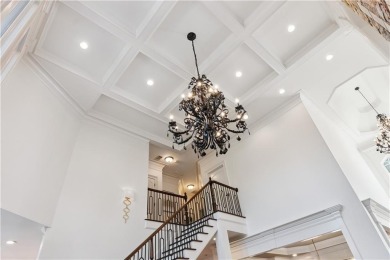 Privately tucked behind a long, tree-lined driveway and greeted on Chateau Elan Golf Club  in Georgia - for sale on GolfHomes.com, golf home, golf lot