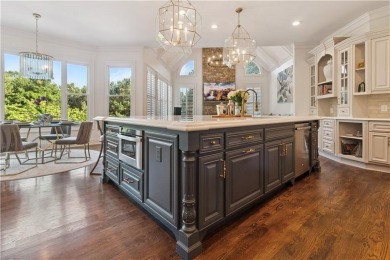 Privately tucked behind a long, tree-lined driveway and greeted on Chateau Elan Golf Club  in Georgia - for sale on GolfHomes.com, golf home, golf lot