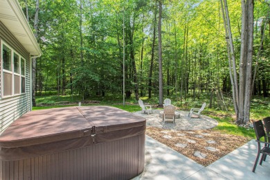 Your wooded sanctuary awaits! Escape to this stunning, newly on Canadian Lakes Country Club-The Royal Course in Michigan - for sale on GolfHomes.com, golf home, golf lot