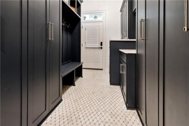 Privately tucked behind a long, tree-lined driveway and greeted on Chateau Elan Golf Club  in Georgia - for sale on GolfHomes.com, golf home, golf lot
