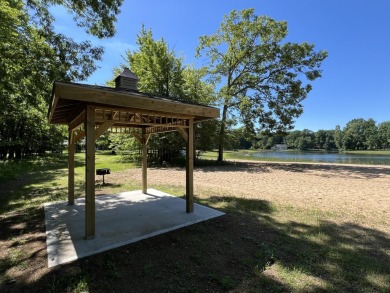 Your wooded sanctuary awaits! Escape to this stunning, newly on Canadian Lakes Country Club-The Royal Course in Michigan - for sale on GolfHomes.com, golf home, golf lot