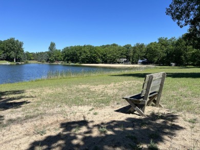 Your wooded sanctuary awaits! Escape to this stunning, newly on Canadian Lakes Country Club-The Royal Course in Michigan - for sale on GolfHomes.com, golf home, golf lot