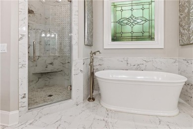 Privately tucked behind a long, tree-lined driveway and greeted on Chateau Elan Golf Club  in Georgia - for sale on GolfHomes.com, golf home, golf lot