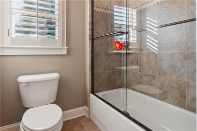 Privately tucked behind a long, tree-lined driveway and greeted on Chateau Elan Golf Club  in Georgia - for sale on GolfHomes.com, golf home, golf lot