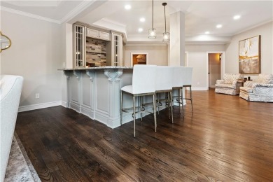 Privately tucked behind a long, tree-lined driveway and greeted on Chateau Elan Golf Club  in Georgia - for sale on GolfHomes.com, golf home, golf lot