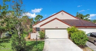 Enjoy stunning water views of the golf course from the back on The Club At Pelican Bay - North Course in Florida - for sale on GolfHomes.com, golf home, golf lot