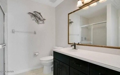 Enjoy stunning water views of the golf course from the back on The Club At Pelican Bay - North Course in Florida - for sale on GolfHomes.com, golf home, golf lot