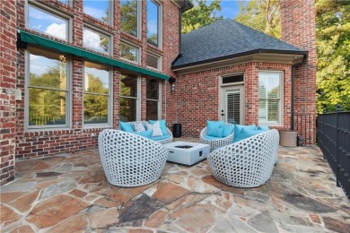 Privately tucked behind a long, tree-lined driveway and greeted on Chateau Elan Golf Club  in Georgia - for sale on GolfHomes.com, golf home, golf lot