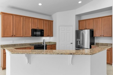 Live the resort lifestyle in this perfectly located, spacious on Hammock Bay in Florida - for sale on GolfHomes.com, golf home, golf lot