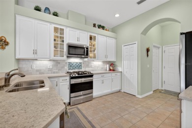 Welcome to this beautifully landscaped Scarsborough model pool on Monarch At Royal Highlands in Florida - for sale on GolfHomes.com, golf home, golf lot