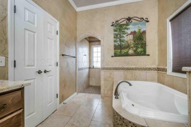 Discover elegance and comfort in this stunning 4-bedroom on Palo Duro Creek Golf Club in Texas - for sale on GolfHomes.com, golf home, golf lot