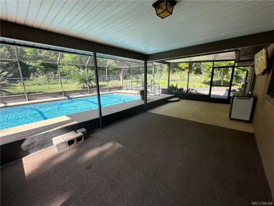 This Citrus Springs pool home offers an elevated position and in on Citrus Springs Country Club in Florida - for sale on GolfHomes.com, golf home, golf lot