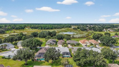 Welcome to this beautifully landscaped Scarsborough model pool on Monarch At Royal Highlands in Florida - for sale on GolfHomes.com, golf home, golf lot
