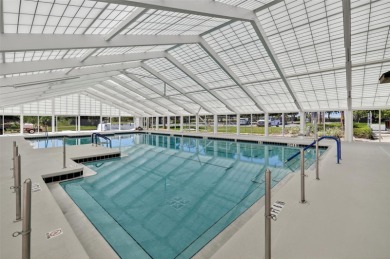 Welcome to this beautifully landscaped Scarsborough model pool on Monarch At Royal Highlands in Florida - for sale on GolfHomes.com, golf home, golf lot