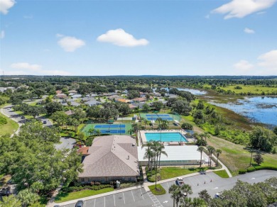 Welcome to this beautifully landscaped Scarsborough model pool on Monarch At Royal Highlands in Florida - for sale on GolfHomes.com, golf home, golf lot