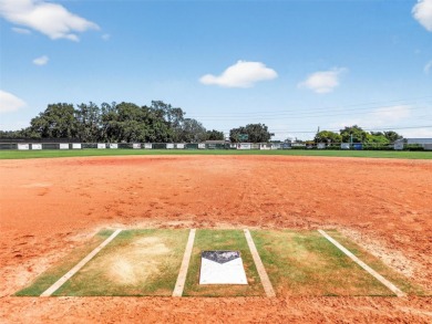Welcome to this beautifully landscaped Scarsborough model pool on Monarch At Royal Highlands in Florida - for sale on GolfHomes.com, golf home, golf lot