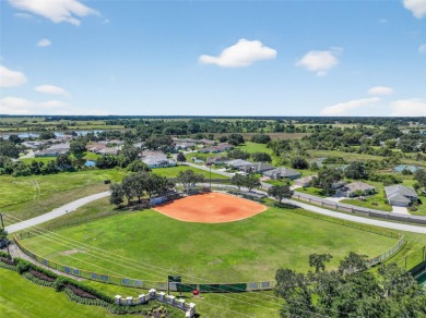 Welcome to this beautifully landscaped Scarsborough model pool on Monarch At Royal Highlands in Florida - for sale on GolfHomes.com, golf home, golf lot