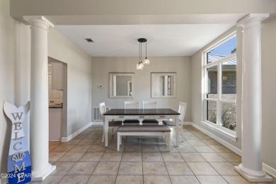 Nestled on an oversized lot, this single-level brick home in on Santa Rosa Golf and Beach Club in Florida - for sale on GolfHomes.com, golf home, golf lot