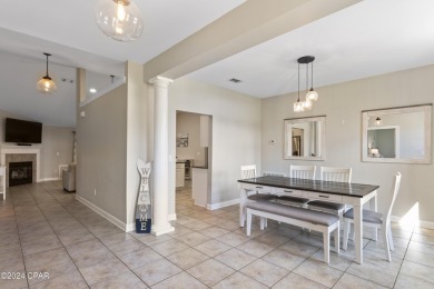 Nestled on an oversized lot, this single-level brick home in on Santa Rosa Golf and Beach Club in Florida - for sale on GolfHomes.com, golf home, golf lot