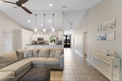 Nestled on an oversized lot, this single-level brick home in on Santa Rosa Golf and Beach Club in Florida - for sale on GolfHomes.com, golf home, golf lot