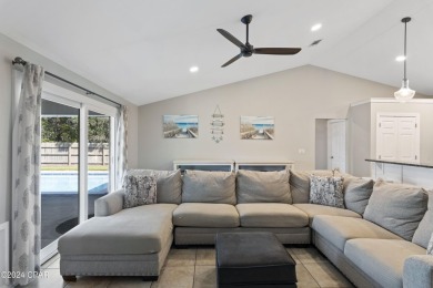 Nestled on an oversized lot, this single-level brick home in on Santa Rosa Golf and Beach Club in Florida - for sale on GolfHomes.com, golf home, golf lot