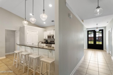 Nestled on an oversized lot, this single-level brick home in on Santa Rosa Golf and Beach Club in Florida - for sale on GolfHomes.com, golf home, golf lot