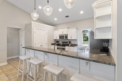 Nestled on an oversized lot, this single-level brick home in on Santa Rosa Golf and Beach Club in Florida - for sale on GolfHomes.com, golf home, golf lot