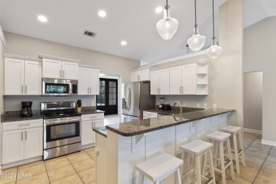 Nestled on an oversized lot, this single-level brick home in on Santa Rosa Golf and Beach Club in Florida - for sale on GolfHomes.com, golf home, golf lot