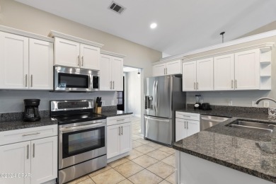 Nestled on an oversized lot, this single-level brick home in on Santa Rosa Golf and Beach Club in Florida - for sale on GolfHomes.com, golf home, golf lot