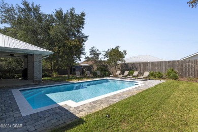 Nestled on an oversized lot, this single-level brick home in on Santa Rosa Golf and Beach Club in Florida - for sale on GolfHomes.com, golf home, golf lot