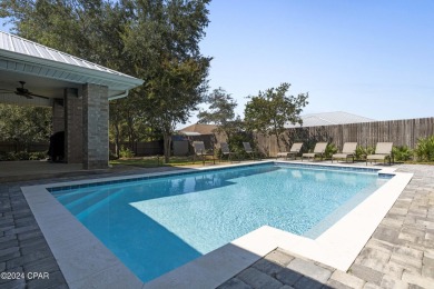Nestled on an oversized lot, this single-level brick home in on Santa Rosa Golf and Beach Club in Florida - for sale on GolfHomes.com, golf home, golf lot