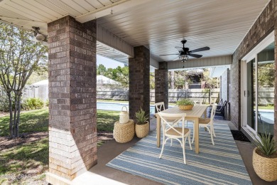 Nestled on an oversized lot, this single-level brick home in on Santa Rosa Golf and Beach Club in Florida - for sale on GolfHomes.com, golf home, golf lot