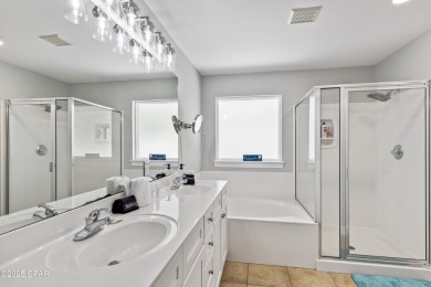 Nestled on an oversized lot, this single-level brick home in on Santa Rosa Golf and Beach Club in Florida - for sale on GolfHomes.com, golf home, golf lot