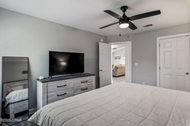 Nestled on an oversized lot, this single-level brick home in on Santa Rosa Golf and Beach Club in Florida - for sale on GolfHomes.com, golf home, golf lot