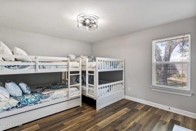Nestled on an oversized lot, this single-level brick home in on Santa Rosa Golf and Beach Club in Florida - for sale on GolfHomes.com, golf home, golf lot