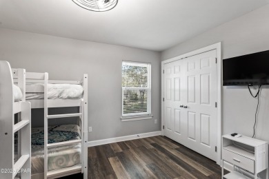 Nestled on an oversized lot, this single-level brick home in on Santa Rosa Golf and Beach Club in Florida - for sale on GolfHomes.com, golf home, golf lot