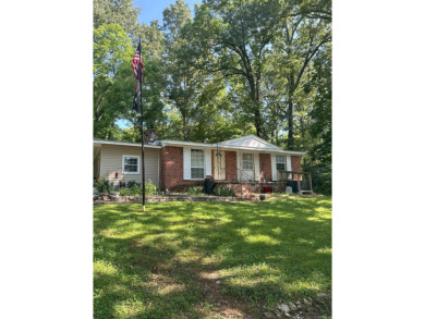 If you are looking for a smaller house with a big big yard on a on Cherokee Village North Course in Arkansas - for sale on GolfHomes.com, golf home, golf lot