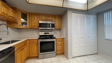 Spacious 2/2 condo in the desirable 55+ community of Palm on Oriole Golf and Tennis Club in Florida - for sale on GolfHomes.com, golf home, golf lot