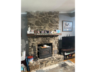 If you are looking for a smaller house with a big big yard on a on Cherokee Village North Course in Arkansas - for sale on GolfHomes.com, golf home, golf lot