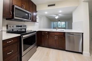 Wake up every morning to peaceful golf course views in one of on Pine Island Ridge Country Club in Florida - for sale on GolfHomes.com, golf home, golf lot