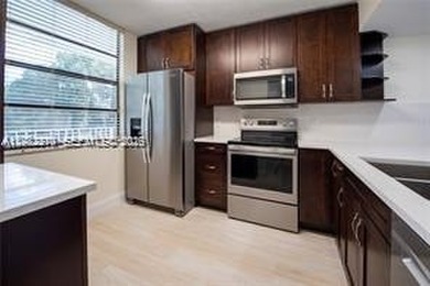 Wake up every morning to peaceful golf course views in one of on Pine Island Ridge Country Club in Florida - for sale on GolfHomes.com, golf home, golf lot