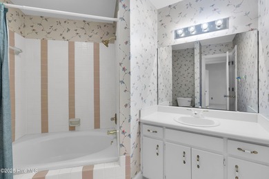 Discover timeless elegance in this custom brick home nestled in on Emerald Golf Club in North Carolina - for sale on GolfHomes.com, golf home, golf lot