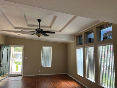 GORGEOUS OPEN AND SPLIT FLOOR PLAN HOME WITH TRAY CEILINGS AND on Silver Dollar Golf and Trap Club in Florida - for sale on GolfHomes.com, golf home, golf lot