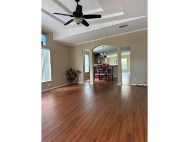 GORGEOUS OPEN AND SPLIT FLOOR PLAN HOME WITH TRAY CEILINGS AND on Silver Dollar Golf and Trap Club in Florida - for sale on GolfHomes.com, golf home, golf lot