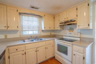 This 3 bedroom, 2.5 bath two-story home with a fireplace is the on Myrtlewood Golf Course and Club  in South Carolina - for sale on GolfHomes.com, golf home, golf lot