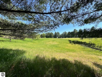 Beautiful, and lightly treed, lot overlooking the 4th fairway at on Shanty Creek Golf Course in Michigan - for sale on GolfHomes.com, golf home, golf lot