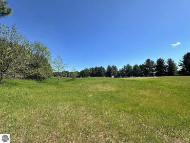 Beautiful, and lightly treed, lot overlooking the 4th fairway at on Shanty Creek Golf Course in Michigan - for sale on GolfHomes.com, golf home, golf lot