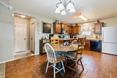 This charming 3 bedroom, 2 bath home is nestled in the highly on Silver Springs Country Club in Arkansas - for sale on GolfHomes.com, golf home, golf lot